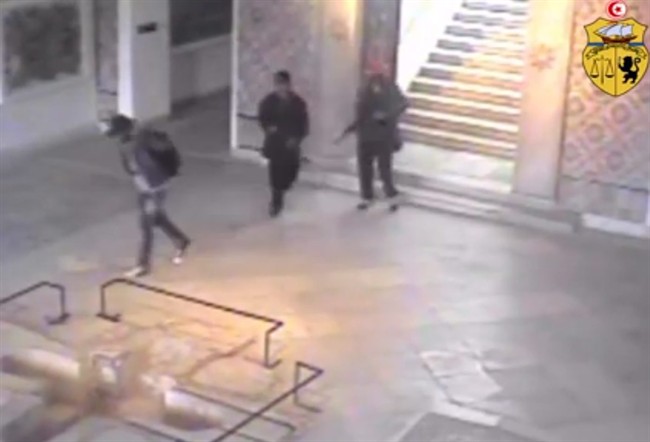 This frame grab from a video released by Tunisia's Interior Ministry shows the gunmen walking through the National Bardo museum during the attack that killed 21 people on Wednesday, March 18, 2015. 