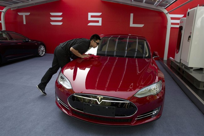 Electric car maker Tesla tops 11,000 vehicles delivered in 2Q, setting new company mark