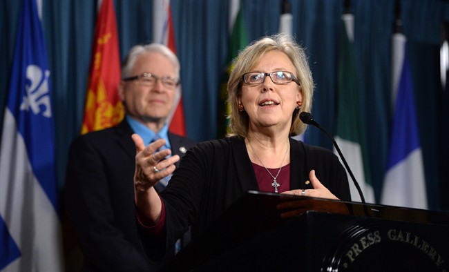 Green Party Leader Elizabeth May, right, and Deputy Leader Bruce Hyer speak during a press conference on Parliament Hill in Ottawa on Monday, March 30, 2015.