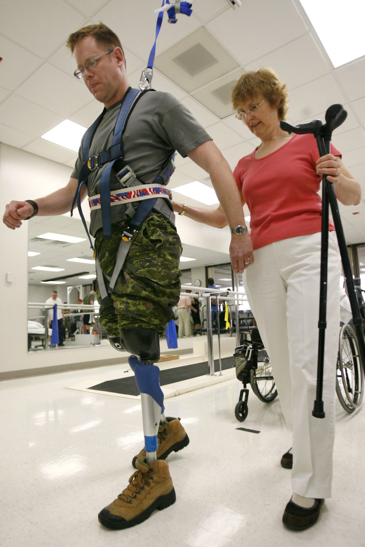 Canadian Master Corp. Paul Franklin with his physical therapist, Bev Agur, of Edmonton, Canada, at Walter Reed Army Medical Center in Washington on Tuesday, April 24, 2007. Franklin lost both legs above the knee while serving in Afghanistan in 2006. He was Canada's first war amputee since the Korean War.
(AP Photo/Jacquelyn Martin).