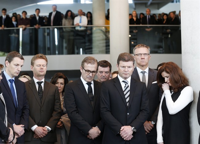 Lufthansa employees take a minute of silence in Frankfurt, Germany, Wednesday, March 25, 2015, for the 150 victims who died in the Germanwings plane crash in the French alps on the way from Barcelona to Duesseldorf on Tuesday. 