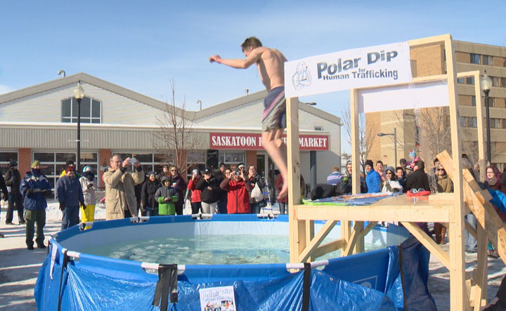 Gutsy people took the plunge into freezing cold water outside on the weekend to raise money for victims of human trafficking.