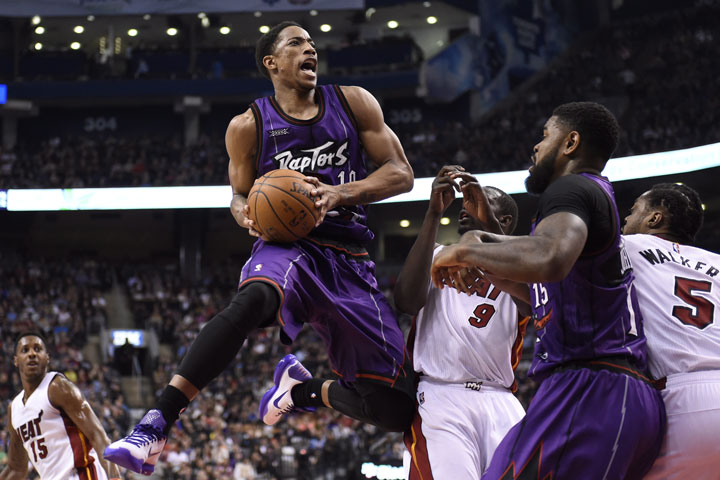 Toronto Raptors' DeMar DeRozan drives for the basket  during first half NBA basketball action against the Miami Heat in Toronto on Friday, March 13, 2015.