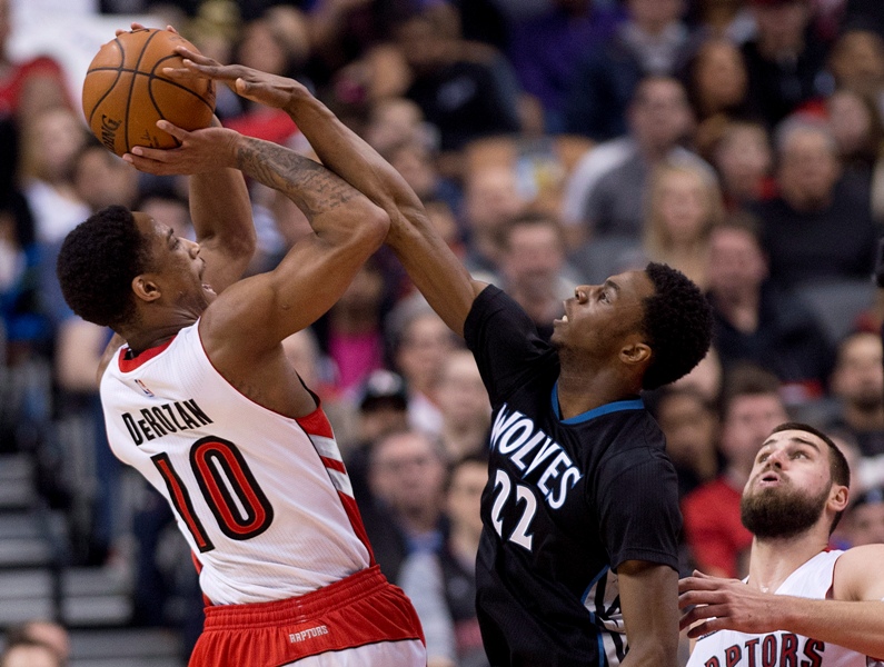 Toronto Raptors' DeMar DeRozan (10) gets fouled by Minnesota Timberwolves' Andrew Wiggins (22) during first half NBA basketball action in Toronto on Wednesday, March 18, 2015.