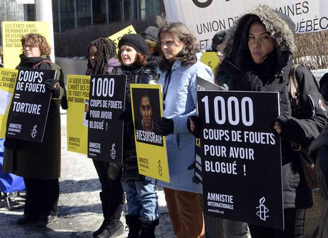 Supporters of Raif Badawi take part in a rally for his freedom Thursday, March 12, 2015 in Montreal. Badawi was sentenced last year to 10 years in prison, 1,000 lashes and a fine of one million Saudi Arabian riyals (about $315,000 Cdn) for offences including creating an online forum for public debate and insulting Islam. (File photo).