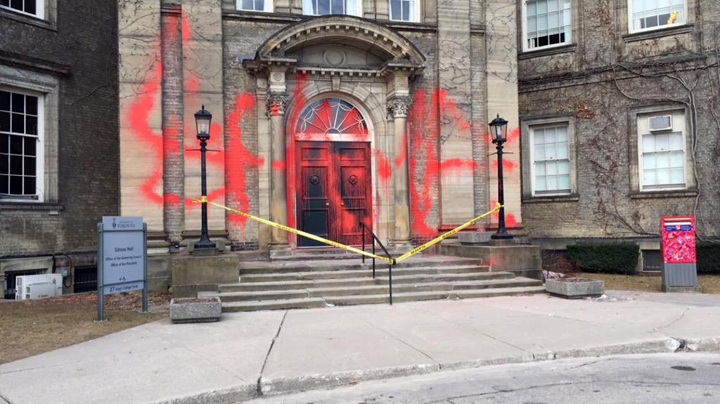 Shame was spraypainted across the doors of Simcoe Hall Friday.