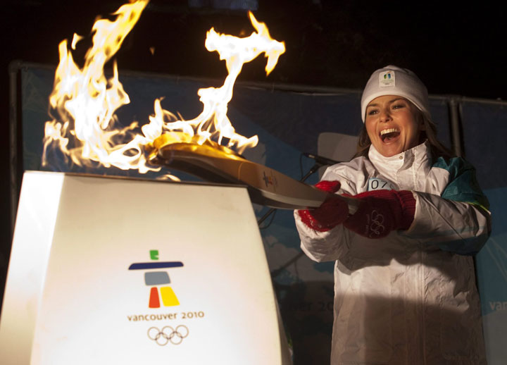 Shania Twain participates in the Olympic torch relay in Timmins, Ont. in 2010.