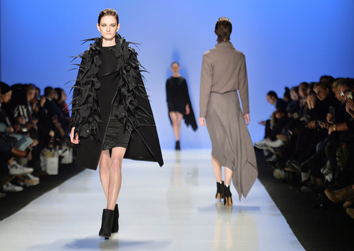 A model walks the runway for the Sid Neigum collection during Toronto fashion week in Toronto on Monday, March 23, 2015. THE