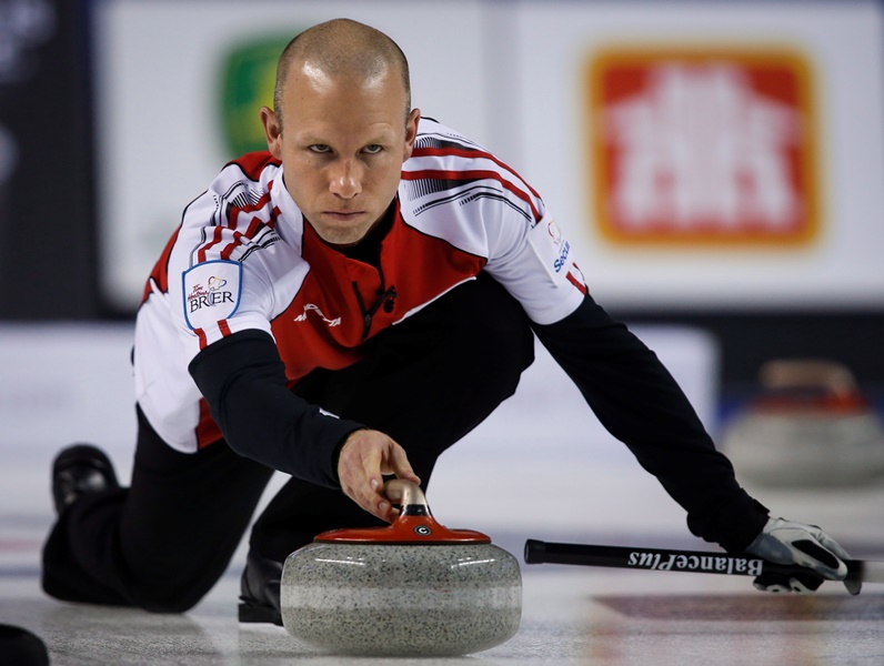 Team Canada skip Pat Simmons delivers a rock as he plays Northern Ontario during gold medal game curling action at the Brier in Calgary on Sunday, March 8, 2015. 