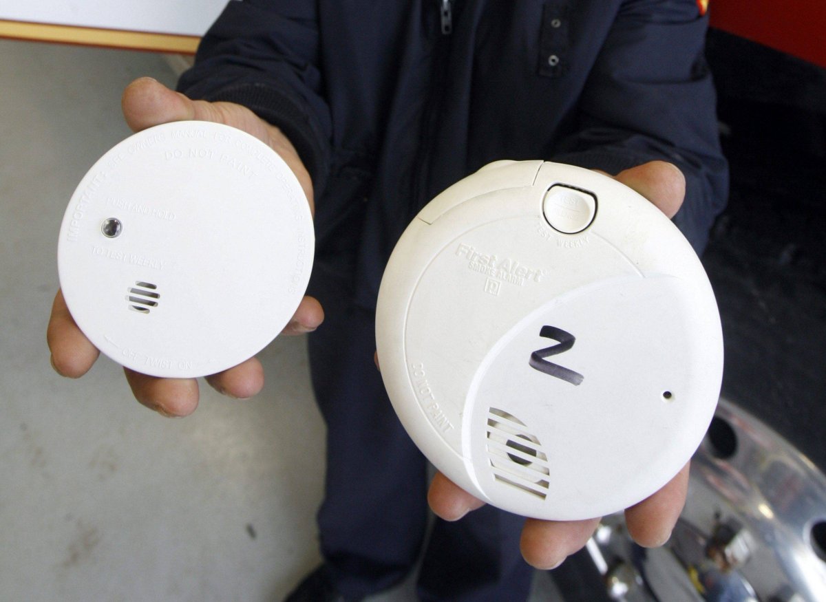 A photoelectric smoke detector on the  right,  and an ionization smoke detector on the left.
