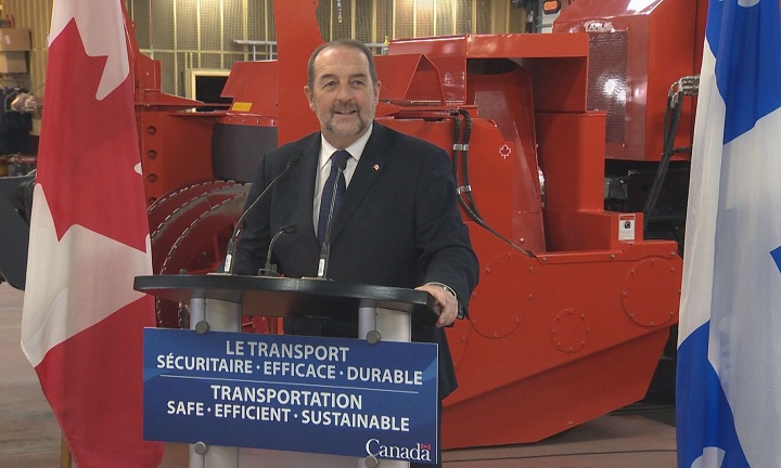 Denis Lebel in St-Hubert to announce federal funding for the airport on March 2, 2015.
