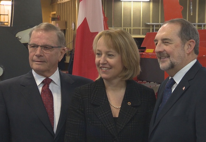Denis Lebel with the Longueuil mayor in St-Hubert to announce federal funding for the airport on March 2, 2015.