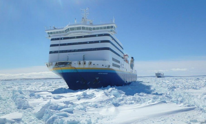 Canadian Coast Guard icebreaker Louis St. Laurent breaking a path for a passenger ferry stuck in heavy ice, Mar. 17, 2015.