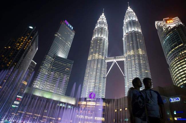 The Petronas Towers, located in Kuala Lumpur, serve as the headquarters for Malaysian energy giant Petronas.