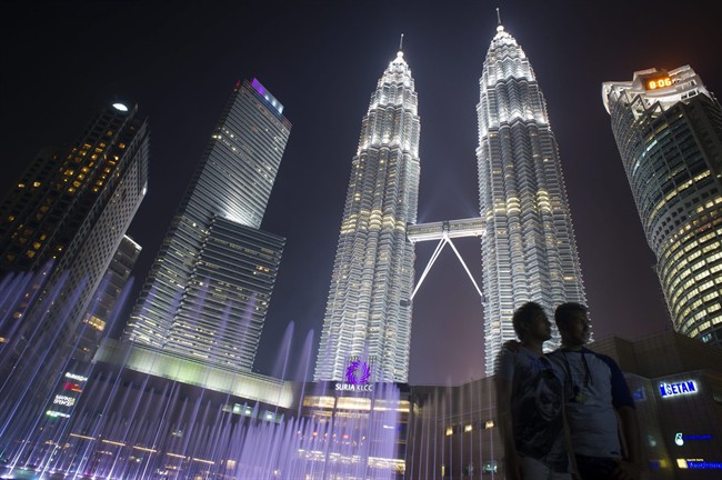The Petronas Towers, located in Kuala Lumpur, serve as the headquarters for Malaysian energy giant Petronas.