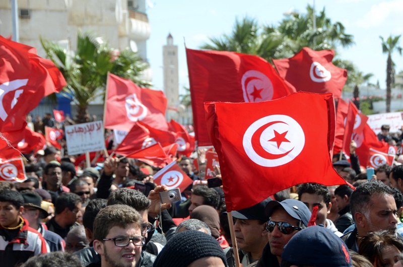 Protestors gather during an anti-extremism march, in Tunis, Sunday, March 29, 2015. Tens of thousands of Tunisians from across the political spectrum marched through the capital Sunday to denounce extremist violence after a deadly museum attack on foreign tourists. Hours ahead of the rally, security forces killed nine terrorist suspects in raids around the country.
