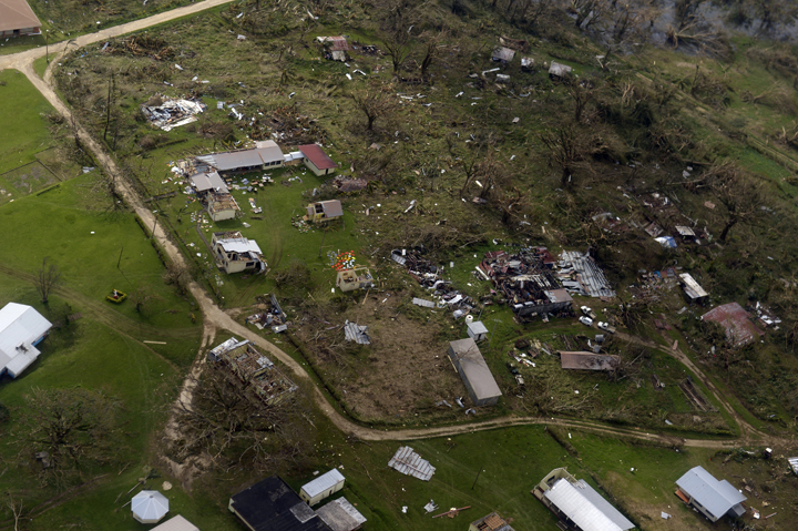 This aerial photo taken on March 16, 2015 above the suburbs of Port Vila shows damages inflicted to buildings in Vanuatu after Super Tropical Cyclone Pam tore through on March 13, 2015.