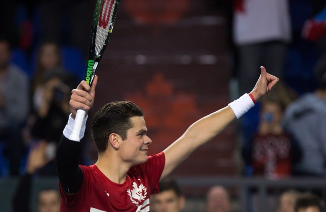 Canada's Milos Raonic, of Toronto, Ont., celebrates after defeating Japan's Tatsuma Ito in straight sets during a Davis Cup tennis world group first round singles match in Vancouver, B.C., on Friday March 6, 2015.