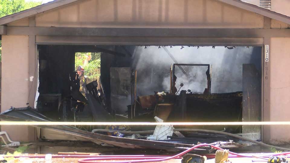 Footage shows firefighter fall through burning roof