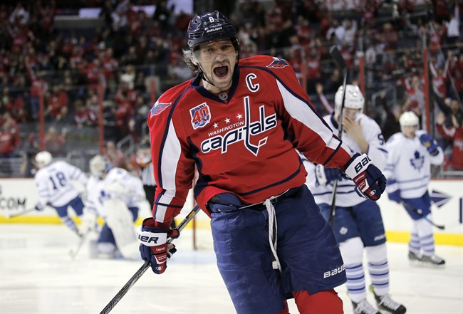 Washington Capitals left wing Alex Ovechkin (8), from Russia, celebrates his goal in the first period of an NHL hockey game against the Toronto Maple Leafs, Sunday, March 1, 2015, in Washington. 
