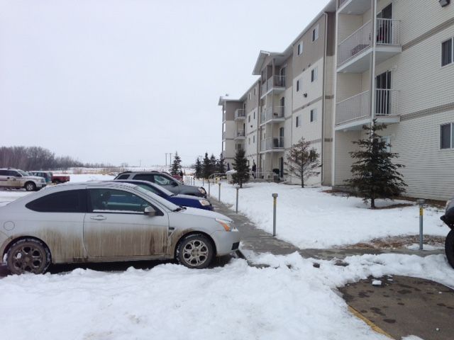 Police tape and an RCMP vehicle could be seen outside an apartment building in Wetaskiwin. A man was airlifted to an Edmonton hospital with potentially life-threatening injuries, following a police shooting on Tuesday morning. March 24, 2015.