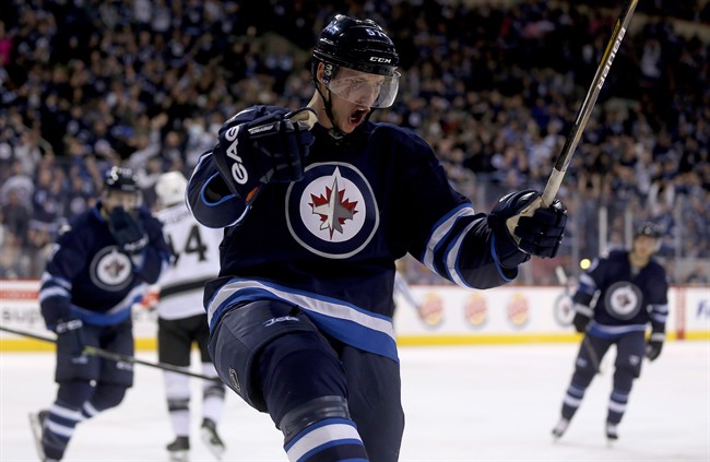 Winnipeg Jets' Tyler Myers celebrates after scoring against the Los Angeles Kings.