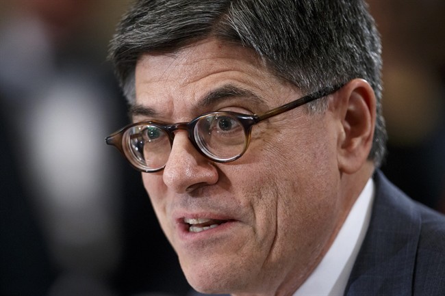 FILE - In this Feb. 3, 2015 file photo, Treasury Secretary Jacob Lew testifies on Capitol Hill in Washington. President Barack Obama slapped sanctions on seven Venezuelan officials Monday, accusing them of perpetrating human rights violations and public corruption.