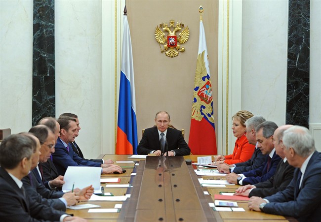 Russian President Vladimir Putin last month praised police and prosecutors for their efforts to battle corruption.  (AP Photo/RIA-Novosti, Mikhail Klimentyev, Presidential Press Service).