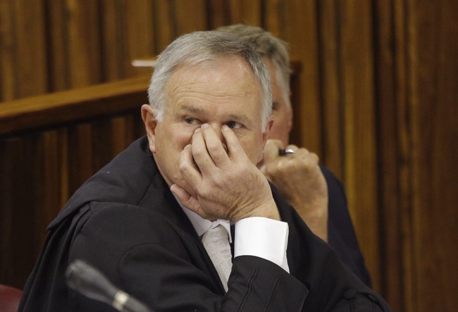 Barry Roux, defence lawyer for Oscar Pistorius, reacts in the High Court in Johannesburg Friday, March 13, 2015. 