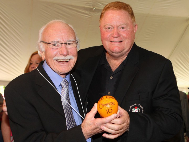 Former Montreal Expos general managers Jim Fanning and Rusty Staub (right) hold an orange with Staub's Expos nickname - Le Grand Orange - during induction ceremonies at the Canadian Baseball Hall of Fame, Saturday June 23, 2012 in St. Marys, Ontario. The former Montreal Expo was the team's first superstar and played for four teams over his 23-year career in the big leagues.