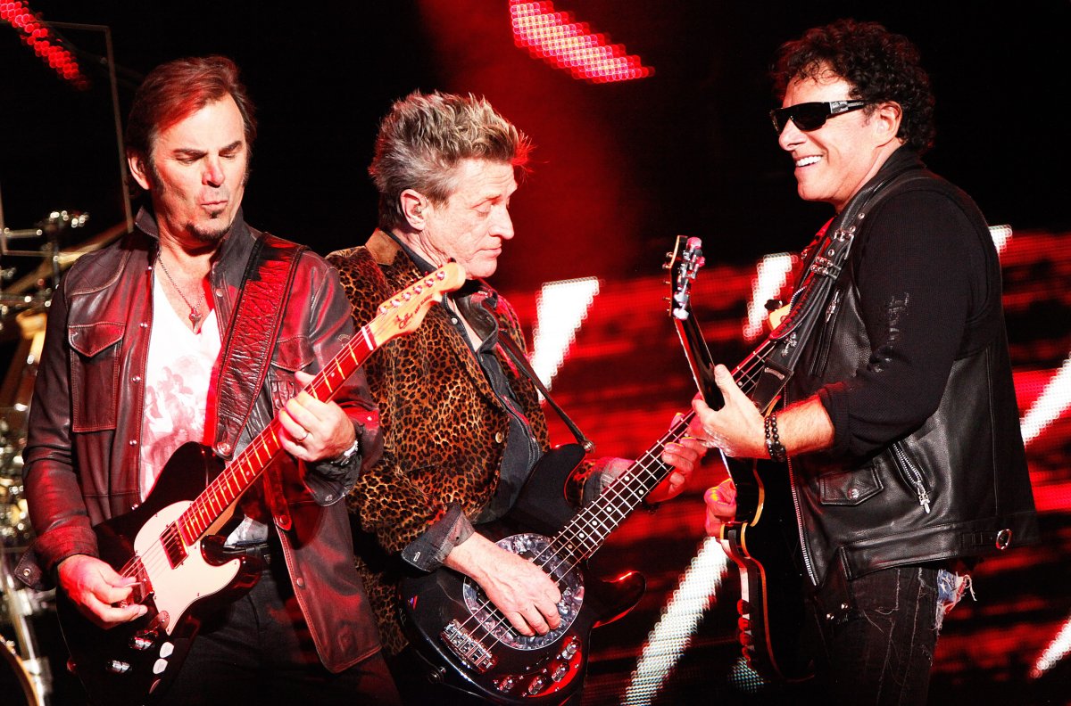 Jonathan Cain, Ross Valory and Neal Schon of Journey in concert at the Van Andel Arena, Grand Rapids, Michigan.