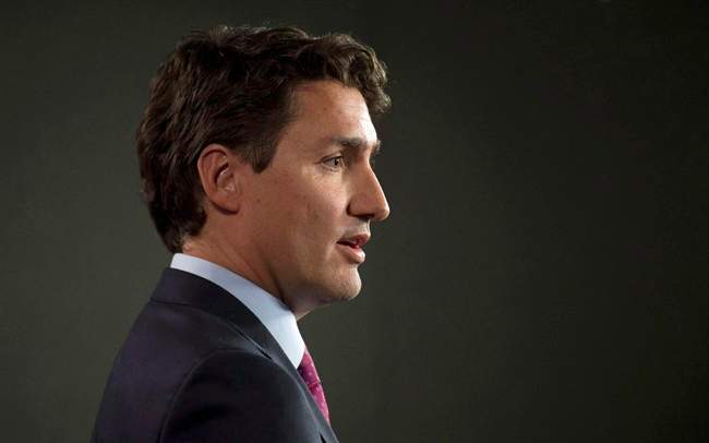 Liberal Leader Justin Trudeau speaks with the media following caucus Wednesday March 25, 2015 in Ottawa. 