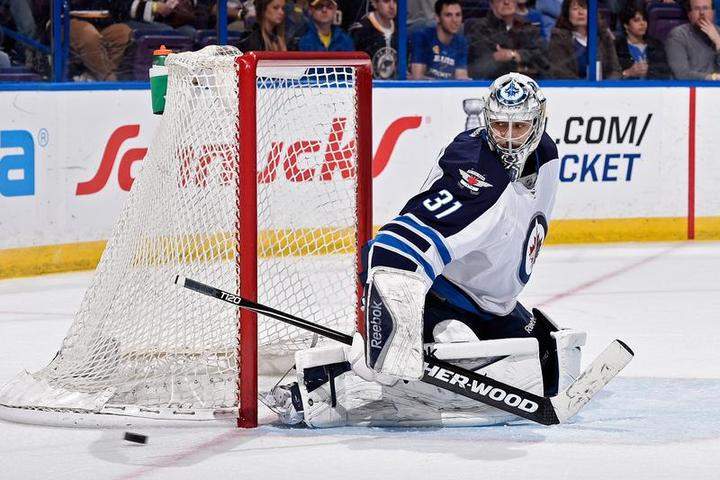 Ondrej Pavelec seen here defending the net against the St. Louis Blues.