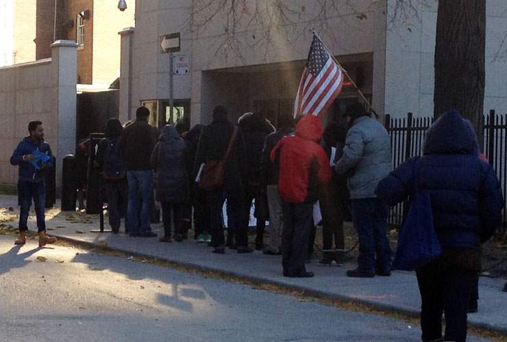 A line of people waits to enter the U.S. consulate in Toronto in November, 2014.