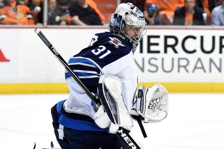Ondrej Pavelec #31 of the Winnipeg Jets makes a kick save during a 4-2 loss to the Anaheim Ducks in Game One of the Western Conference Quarterfinals during the 2015 NHL Stanley Cup Playoffs at Honda Center on April 16, 2015 in Anaheim, Calif.