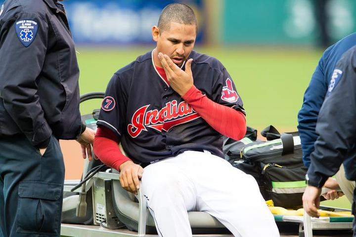 Starting pitcher Carlos Carrasco #59 of the Cleveland Indians is helped off the field after being hit in the face by a line drive off the bat of Melky Cabrera of the Chicago White Sox during the first inning at Progressive Field on April 14, 2015 in Cleveland, Ohio.