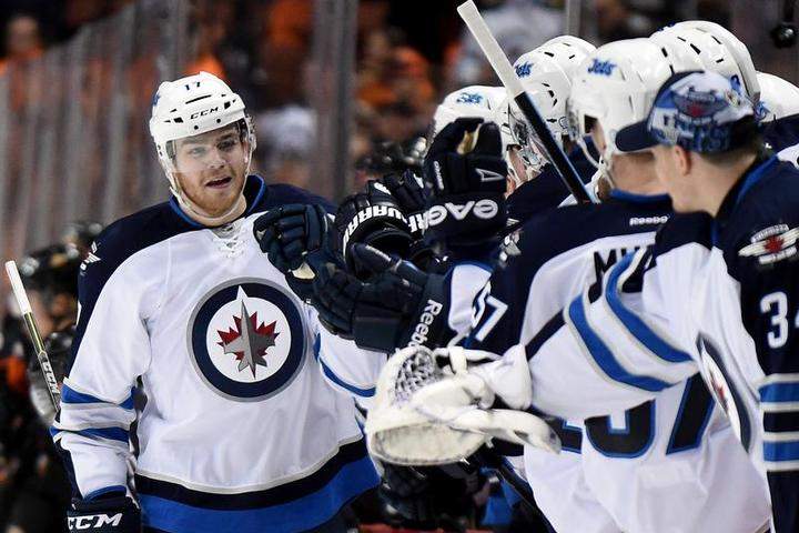 Winnipeg Jets forward Adam Lowry has been placed on injured reserve along with Drew Stafford.