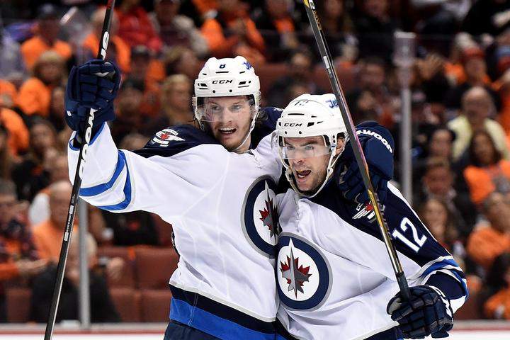 Drew Stafford #12 of the Winnipeg Jets reacts to his goal with Jacob Trouba #8 to take a 2-1 lead over the Anaheim Ducks during the second period in Game One of the Western Conference Quarterfinals during the 2015 NHL Stanley Cup Playoffs at Honda Center on April 16, 2015 in Anaheim, Calif.