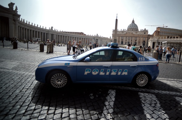 A police car patrols around Saint Peter's Square at the Vatican on September 20, 2014. 