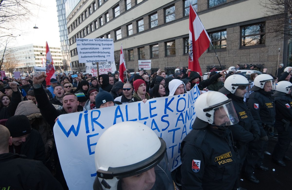 Austrian riot policemen escort a demonstration of the right-wing populist movement PEGIDA (Patriotic Europeans Against the Islamisation of the Occident) in Linz, Austria, on February 8, 2015.