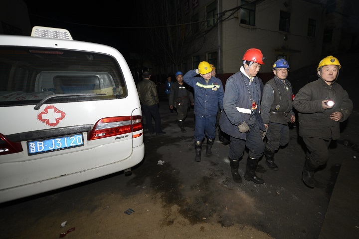 Rescue workers search for victims at a coal mine that flooded on April 20, 2015 in Datong, Shanxi province of China. The coal mine in east China's Shanxi province, owned by Datong Coal Mine Group,  flooded yesterday.