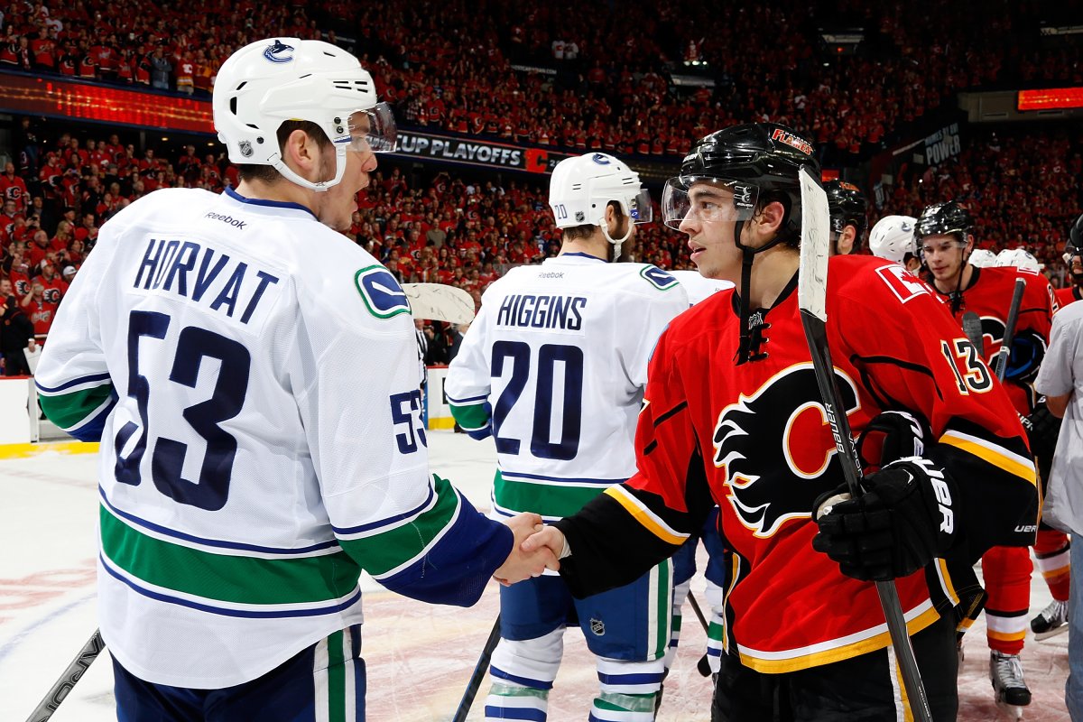 Johnny Gaudreau shakes hands with Bo Horvat on April 25, 2015 in Calgary, Alberta, Canada. The Flames won 7-4. 