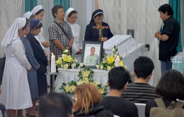 Priest and nuns pray next to the coffin of executed Brazilian drug convict Rodrigo Gularte at the hospital morgue in Jakarta on April 29, 2015. Indonesia on April 29 staunchly defended its execution of seven foreigners including two Australians as a vital front of its "war" on drugs as testimony emerged of how they went singing to their deaths.