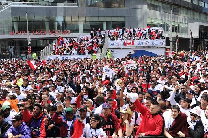 Fans watch the game at Maple Leaf Square with the Brooklyn Nets against the Toronto Raptors in Game Seven of the Eastern Conference Quarterfinals during the NBA Playoffs at the Air Canada Centre on May 4, 2014 in Toronto, Ontario, Canada