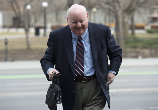 Suspended Senator Mike Duffy arrives at the courthouse for his trial in Ottawa, Friday, April 17, 2015. THE CANADIAN PRESS/Adrian Wyld.