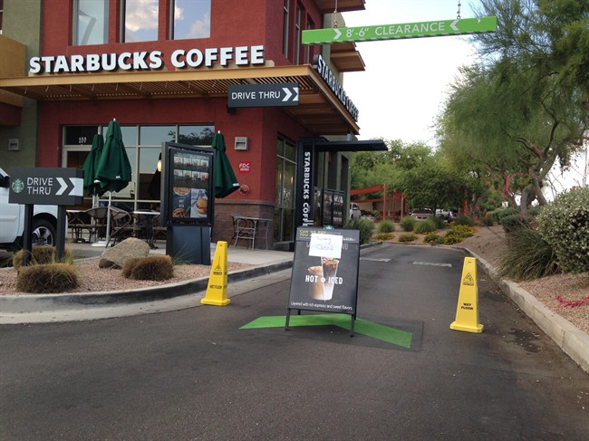 A Starbucks store closes Friday, April 24, 2015, in Phoenix because of computer issues. Starbucks says a sales register computer glitch has disrupted sales at company-operated stores in the United States and Canada. 
