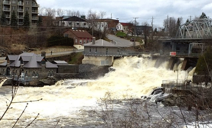 MuskokaNewsWatch .com published this photo of water spilling over the dam at Bracebridge Falls.