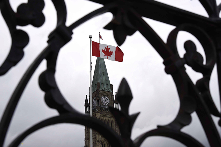 Centre Block's Peace Tower is shown through the gates of Parliament Hill as Finance Minister Joe Oliver prepares to table the budget in Ottawa on Tuesday, April 21, 2015.