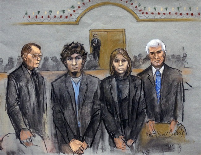 In this courtroom sketch, Dzhokhar Tsarnaev, second from left, is depicted standing with his defense attorneys as the jury presents its verdict in his federal death penalty trial Wednesday, April 8, 2015, in Boston. Tsarnaev was convicted on multiple charges in the 2013 Boston Marathon bombing.