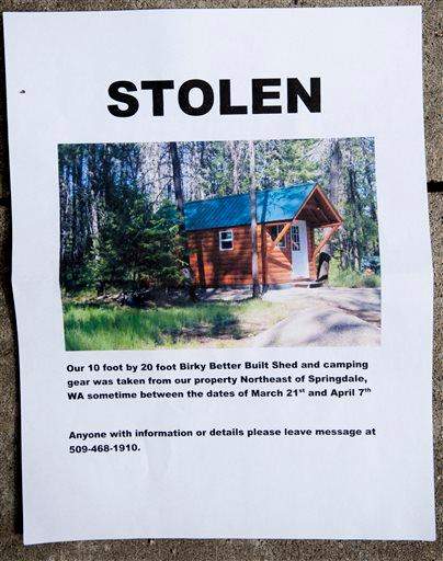 A notice sign for the Hempel's stolen cabin is displayed on Wednesday, April 8, 2015, near Springdale, Wash. 